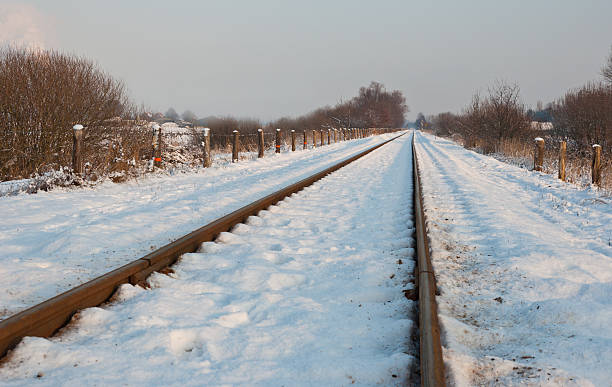 istock Railway tracks in the winter snow 521624835