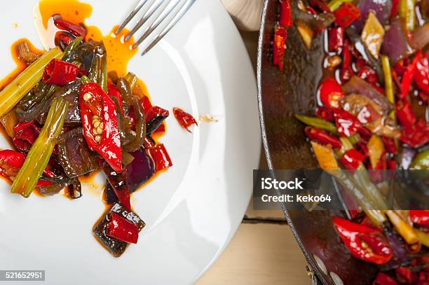 Fried Chili Pepper And Vegetable On A Wok Pan Stock Photo - Download Image Now - Bok Choy, Broccoli, Carrot