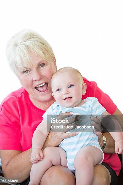 Four Month Old Baby Boy Being Held By Proud Grandmother Stock Photo - Download Image Now