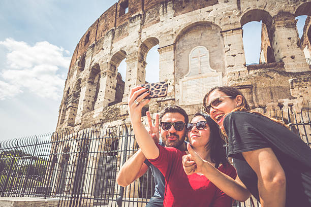 istock Tourists taking a selfie in front of the Coliseum, Rome 521653897