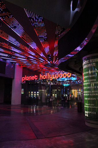 Las Vegas, NV, United States - October 22, 2014: View of the Planet Hollywood entrance illuminated at night. Planet Hollywood is one of the famous hotels on Las Vegas Strip.