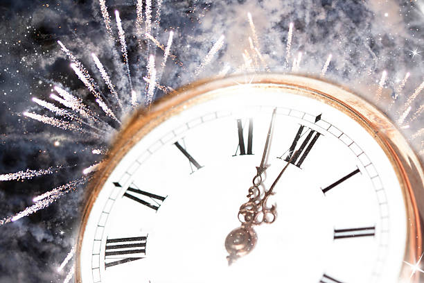 istock New Year's at midnight - Old clock and holiday lights 521667619