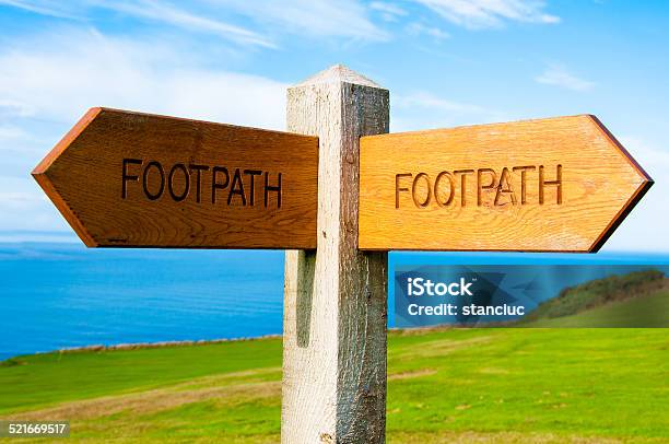 Footpath Direction Sign In English Countryside Stock Photo - Download Image Now - Aiming, Arrow Symbol, British Culture