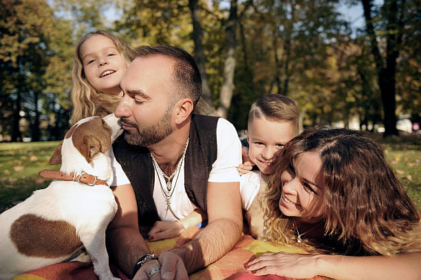 istock happy family in autumn park 521669543