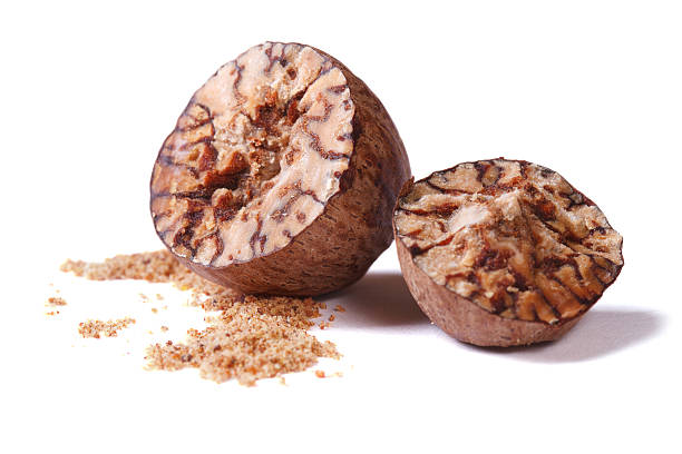 istock chopped and ground nutmeg isolated on white background 521681403