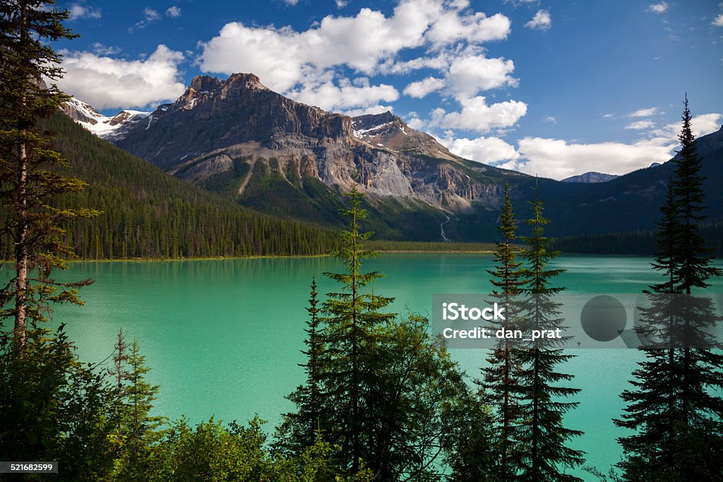 Emerald Lake, Yoho National Park A calm morning on Emerald Lake with the sun just rising above the peaks. Beauty In Nature Stock Photo