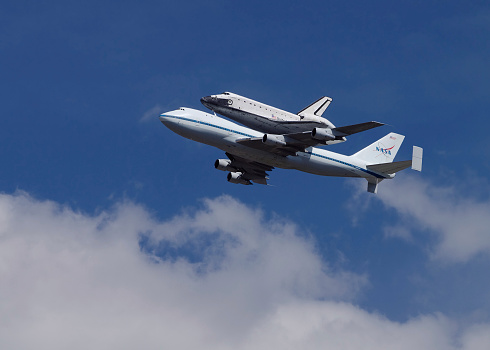 Pasadena (CA), USA - September 21, 2012: the NASA space shuttle Endeavour is shown atop a Shuttle Carrier Aircraft flying over the Jet Propulsion Laboratory.