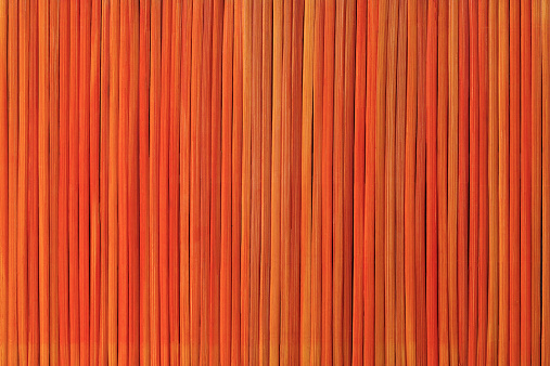 Orange bamboo slatted background.