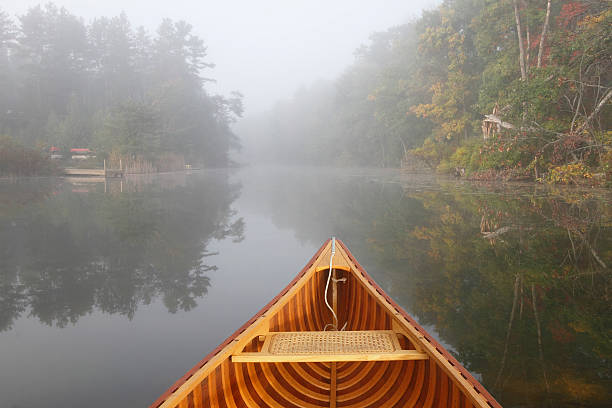 istock Canoe Bow on a Misty Autumn River 521683481
