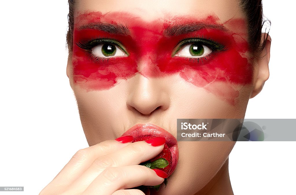 The Mask. Mysterious Girl The mask. Mysterious girl. Beautiful face woman with makeup eye mask. Closeup portrait isolated on white Strawberry Stock Photo