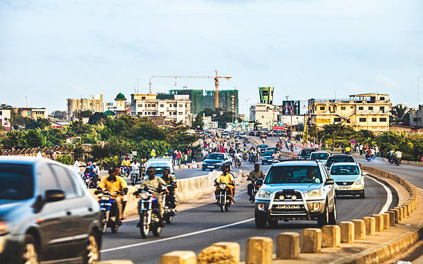 African city traffic. City traffic just before sunset. benin stock pictures, royalty-free photos & images