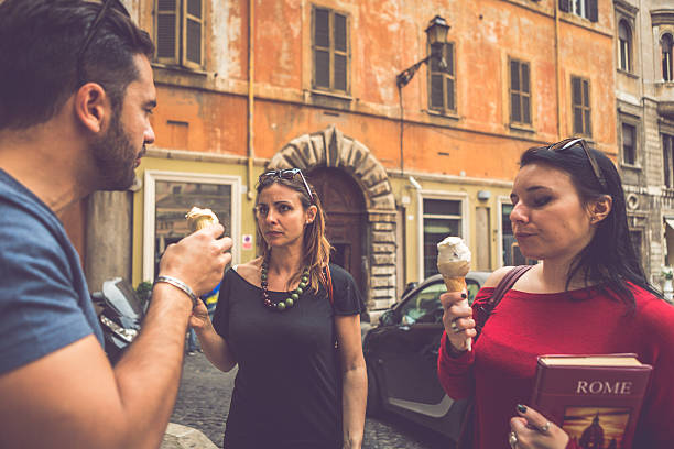istock Tourists with a guide eating icecream in Rome 521685513