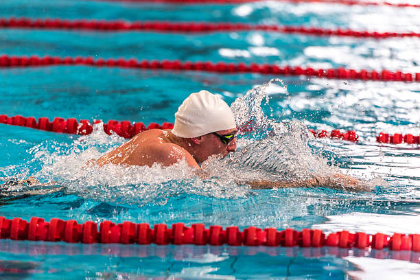 istock Male swimmer swimming 521685660