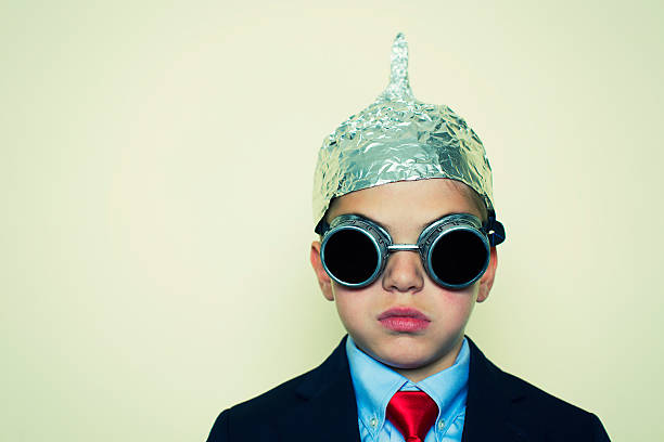istock Boy Businessman in Tinfoil Hat 521685669