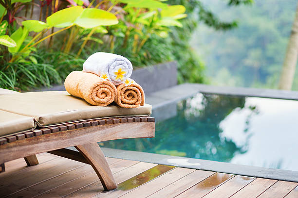 istock Towels with white frangipani flowers in spa 521685735