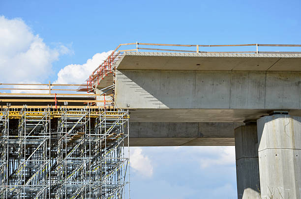Highway building process: building of carriageway over land on pillars
