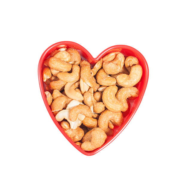 istock heart shape from cashew. Isolated on a white 521687684