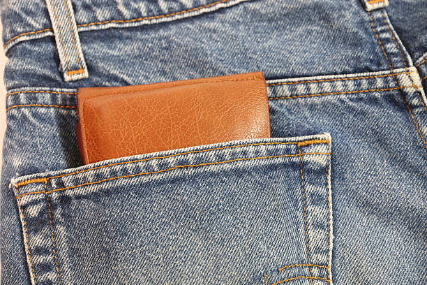 istock Brown wallet in the pocket's open hearing. 521688948
