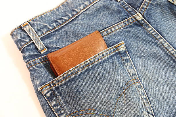 istock Brown wallet in the pocket's open hearing. 521689044