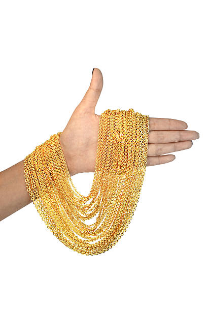gold necklace on hand