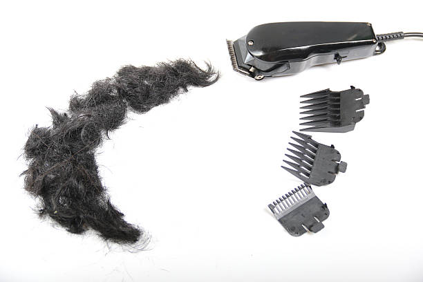 istock Hairclipper electricity with hairs on a white background. 521691144