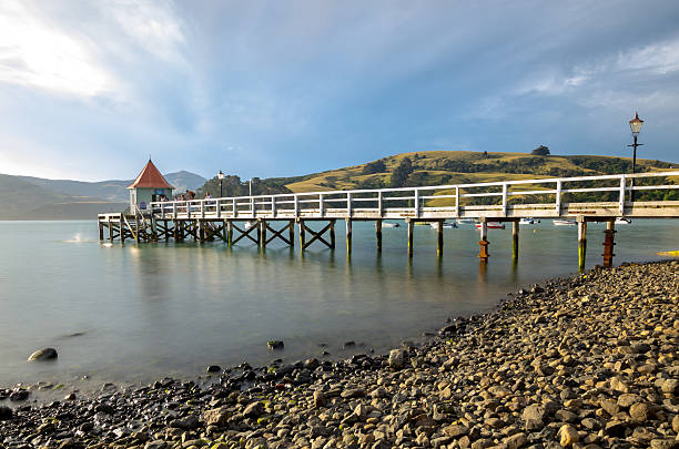 istock Akaroa jetty pier, New Zealand 521691956