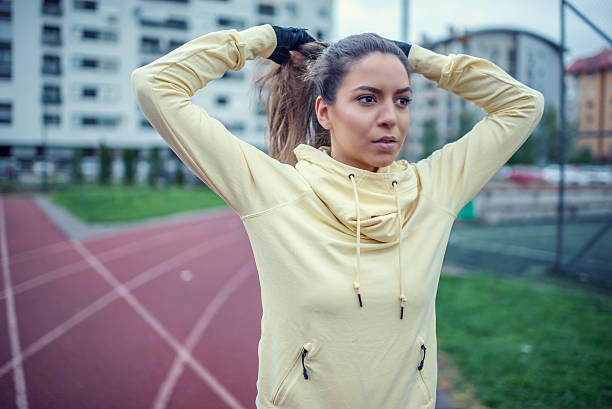 istock Athlete young woman at running track. 521692200