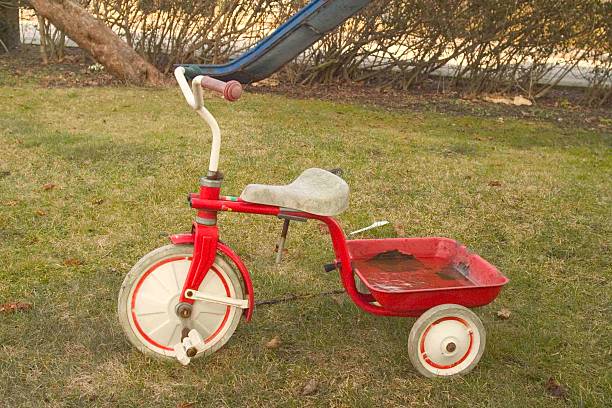 istock Old red and white childs bike 521692544