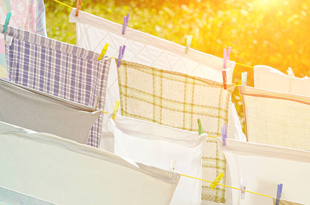 istock Laundry hanging on a clothesline in sunshine 521693072