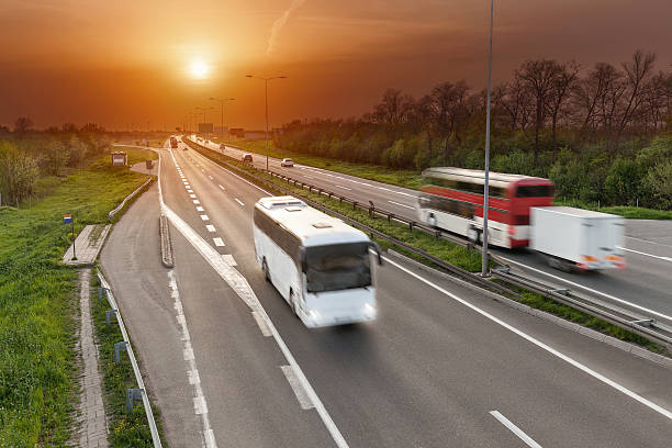 istock Fast travel buses on the highway at sunset 521694516