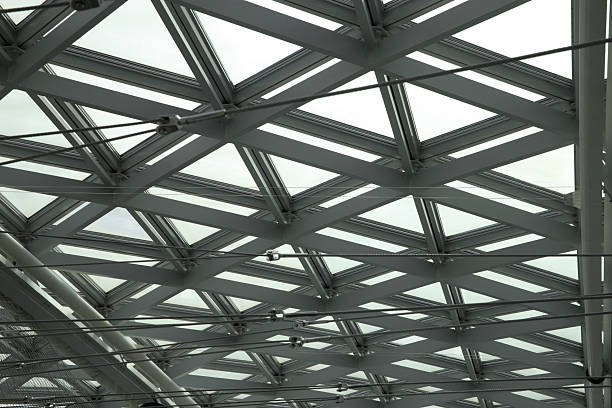 istock Modular steel-and-glass ceiling with cable track lighting system 521695072