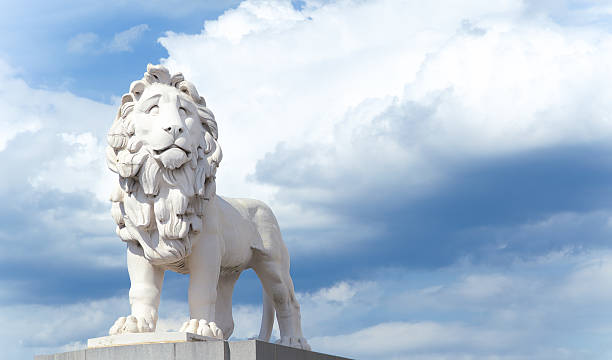 Coade Stone Lion on Westminster Bridge Coade Stone Lion on Westminster Bridge against dramatic sky london county hall stock pictures, royalty-free photos & images