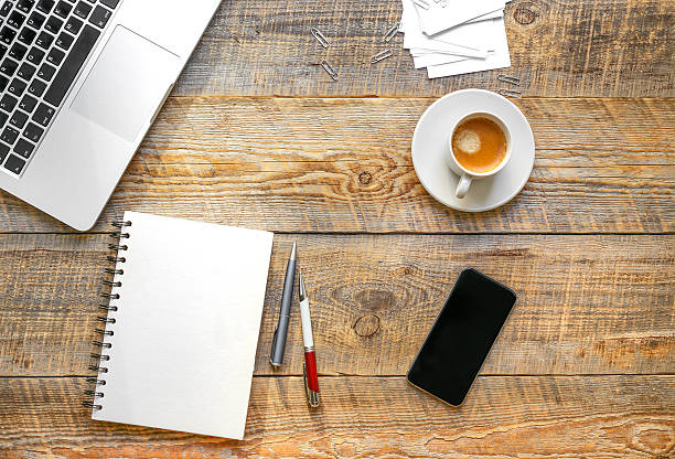 istock Working place with laptop on wooden table 521696348