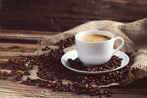 istock Cup of coffee with coffee beans 521696816
