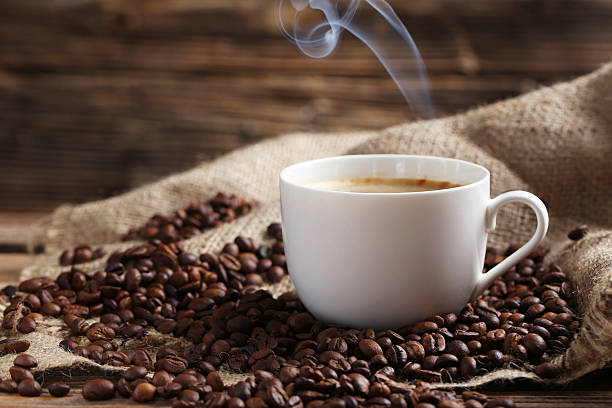 istock Cup of coffee with coffee beans 521696874