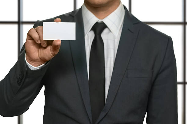 istock Businessman showing his visit card. 521697150