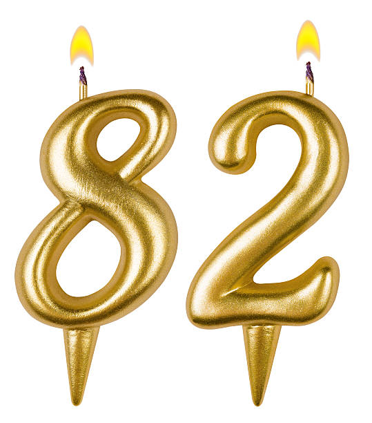 istock Birthday candles number eighty two isolated on white background 521697257