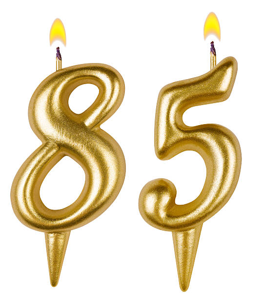 istock Birthday candles number eighty five isolated on white background 521697307