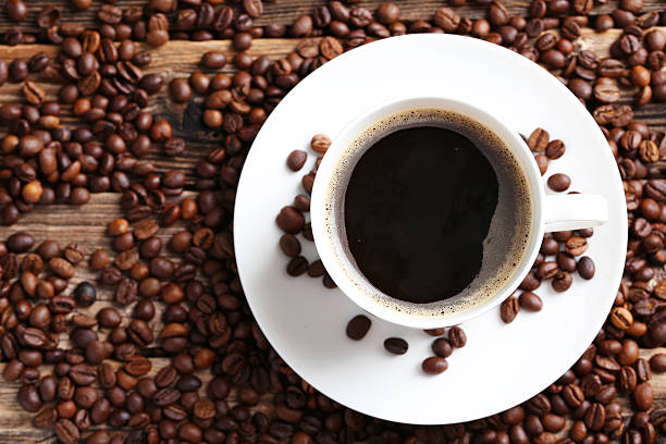 istock Cup of coffee with coffee beans 521697364