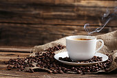 istock Cup of coffee with coffee beans 521697444