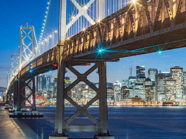istock Bay Bridge and skyline of San Francisco at night 521697828