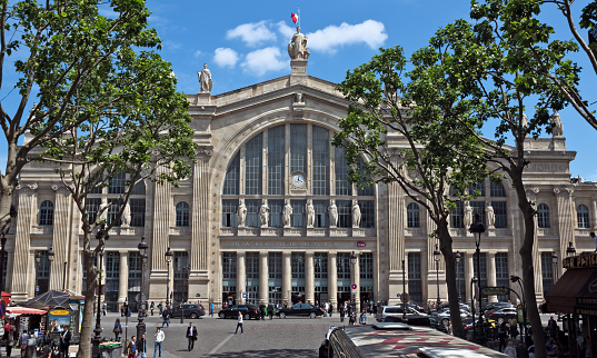 Paris, France - June 11, 2014: Gare du Nord (North Station, designed by Jacques Hittorff, 1864) - one of the six large SNCF terminal in Paris, largest and oldest railway stations in Paris. People are walking near the station.