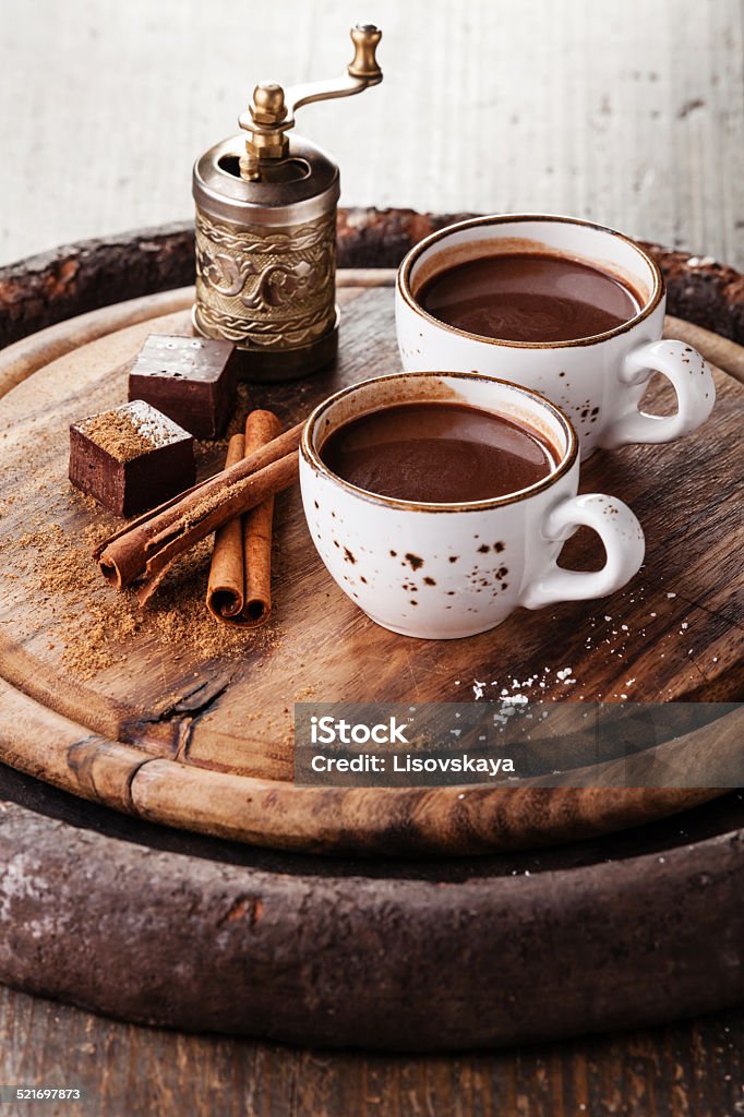Hot chocolate Hot chocolate sprinkled with white chocolate and spices on dark wooden background White Chocolate Stock Photo