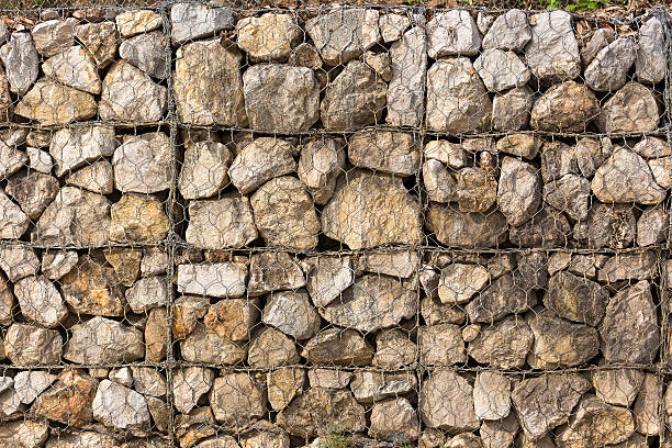 istock Stone construction with steel mesh which was dam embankment eros 521698828