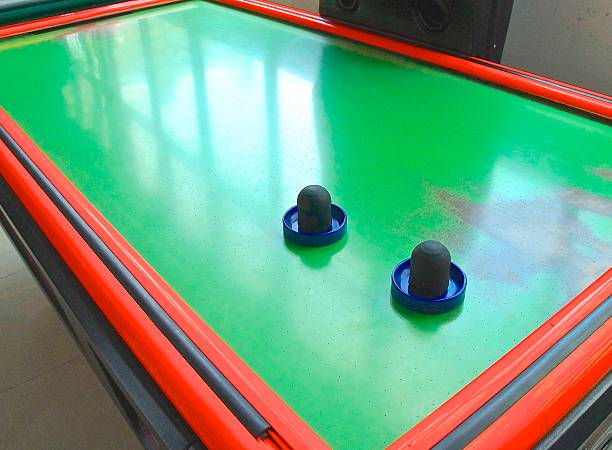 istock Air hockey table closeup with paddle 521699495