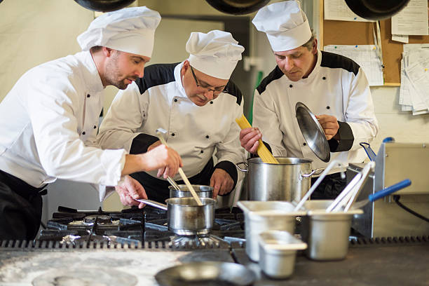 istock Three men busy in the commercial kitchen 521701456