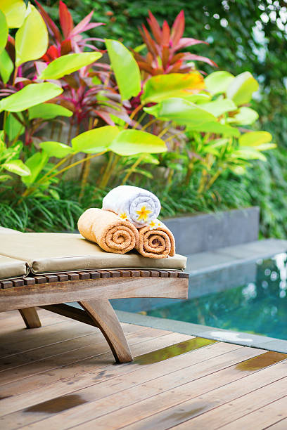 istock Towels with white frangipani flowers in spa 521702831