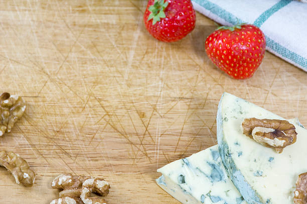 istock Tasty blue cheese roquefort, strawberries and nuts as background 521703820
