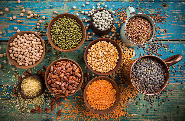 istock Various legumes on old rustic wooden table 521703994