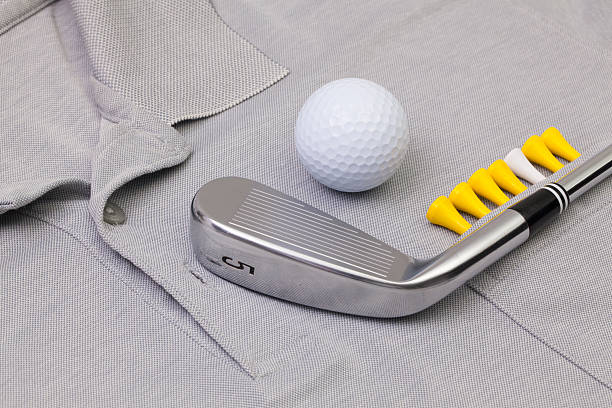 istock Grey polo shirt and golf equipments 521704072